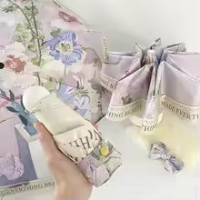 Handmade plush toy with decorative elements on a white surface